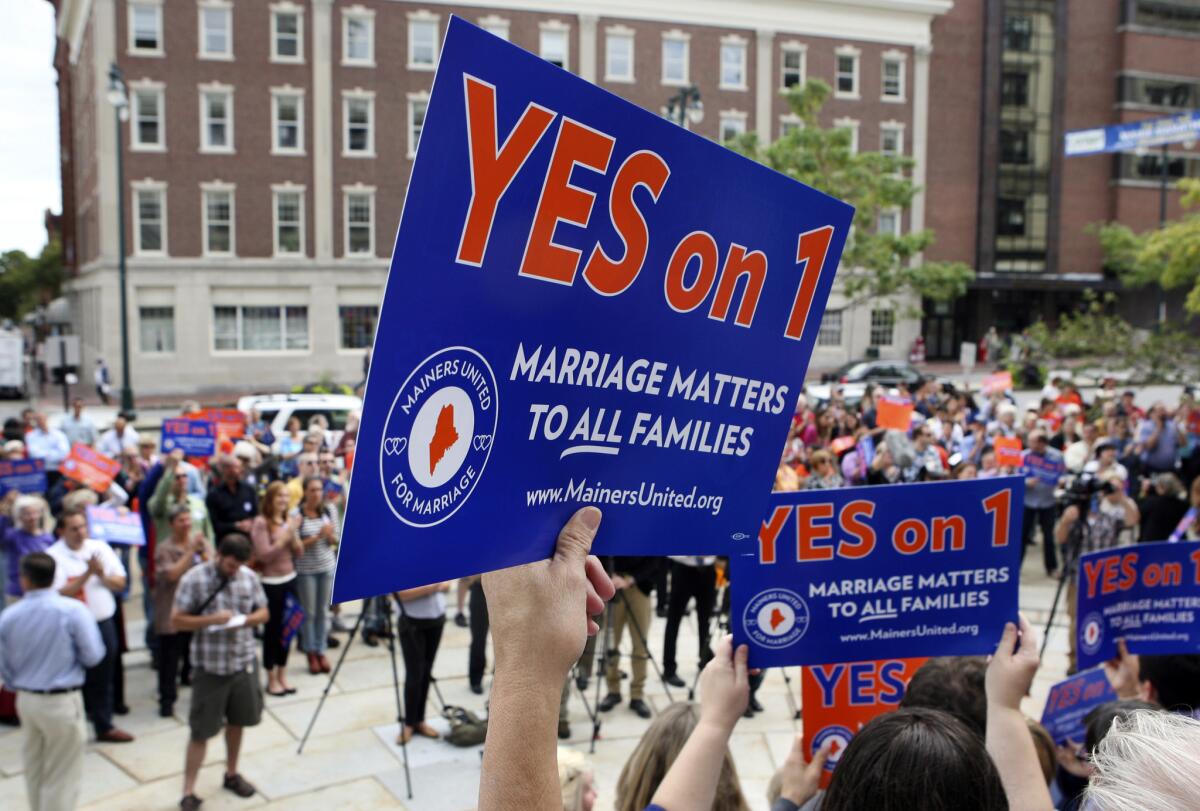 Gay marriage supporters gather at a rally outside of City Hall in Portland, Me. in support of an Nov. ballot question that seeks to legalize same-sex marriage. Maryland and Washington will also vote next month on allowing same-sex marriage.