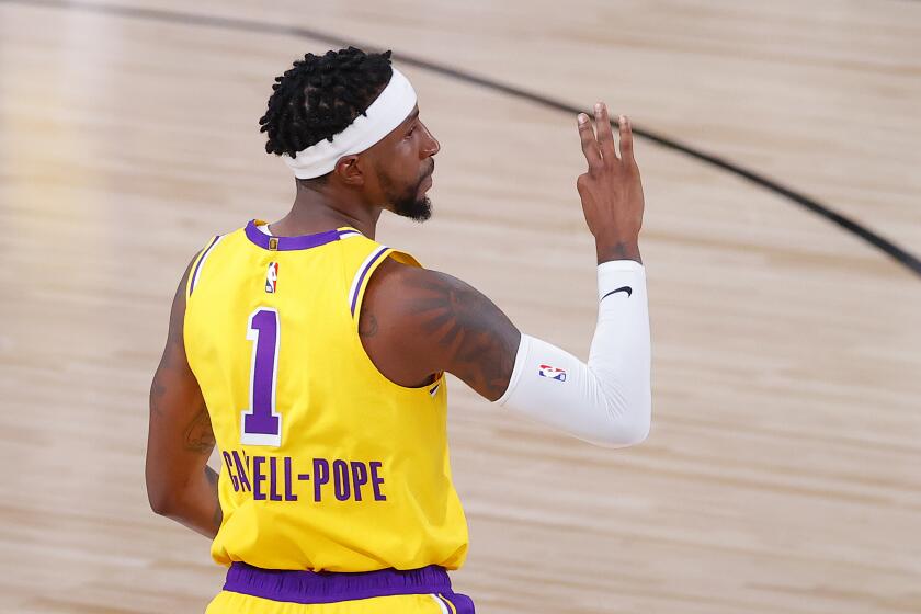 Los Angeles Lakers' Kentavious Caldwell-Pope reacts after his three-point basket during the third quarter.
