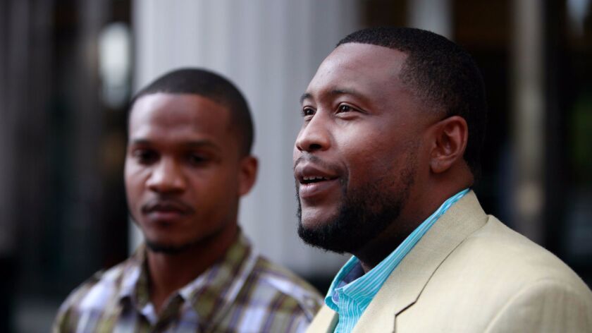 San Diego-based rapper Brandon Duncan, right, and Aaron Harvey at press conference held in March 2015 after gang conspiracy charges filed against them were dismissed.