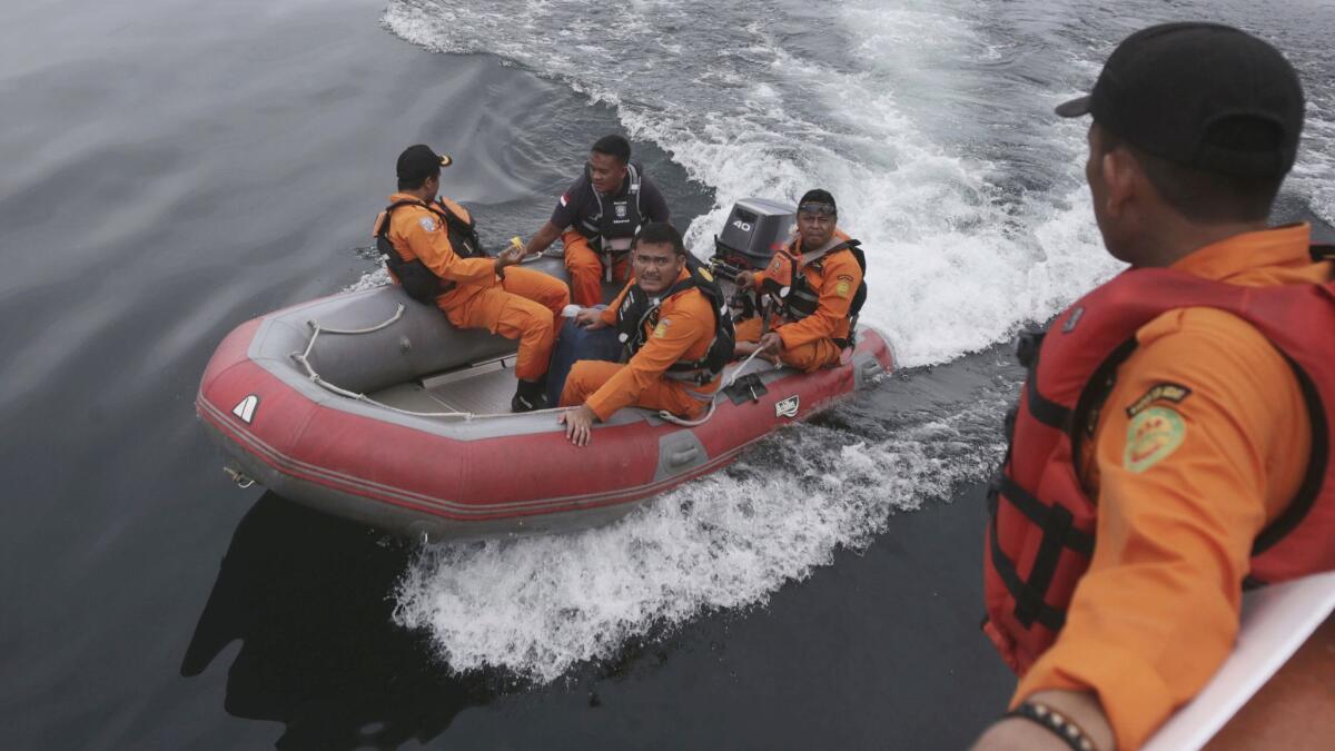 Indonesian rescuers search Wednesday for the ferry that sank on Monday in Lake Toba, North Sumatra, Indonesia.