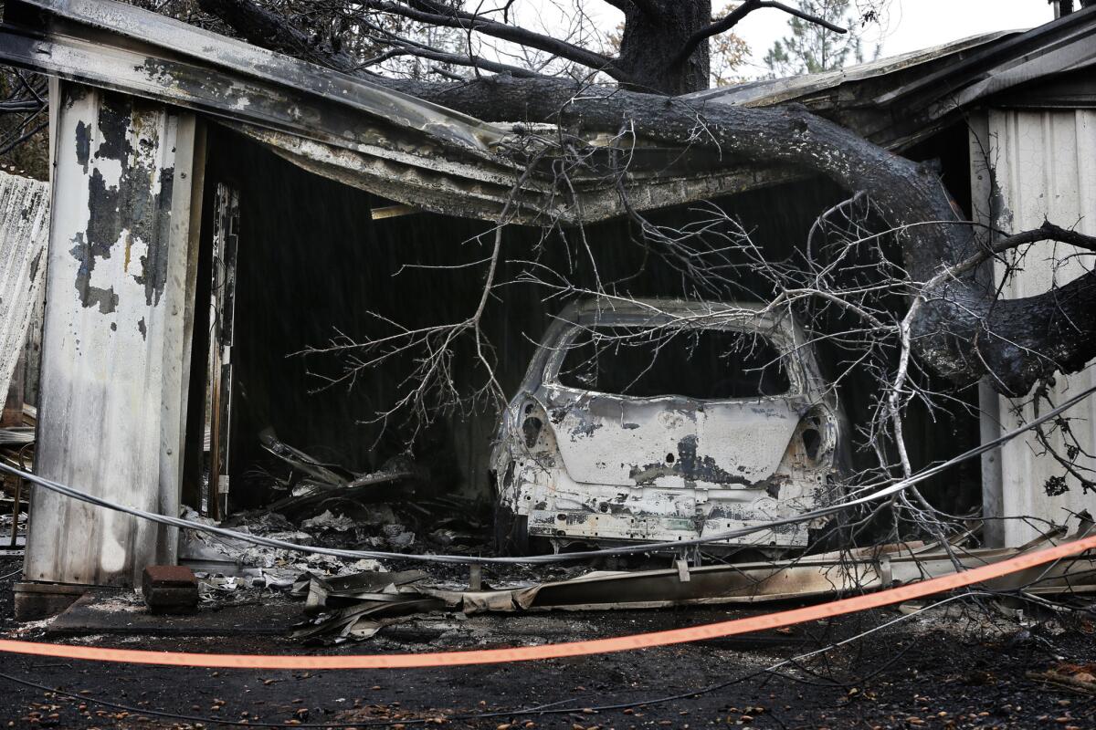 The charred remains of a garage in a wooded neighborhood in Middletown days after the Valley fire swept through the area.