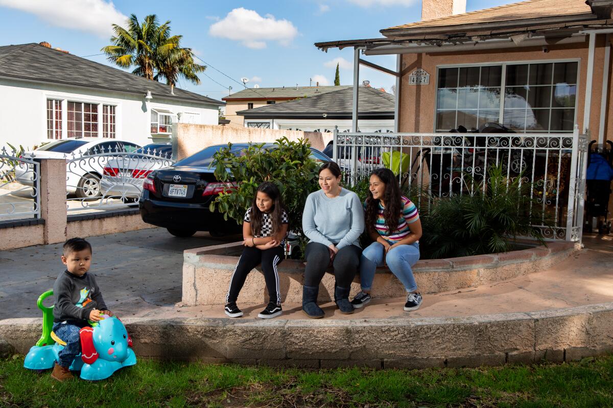 Valeria, 8, and Keyla, 12, enjoy their 2-year-old brother, Carlos, but he can be distracting, says their mother Norma Quijas.