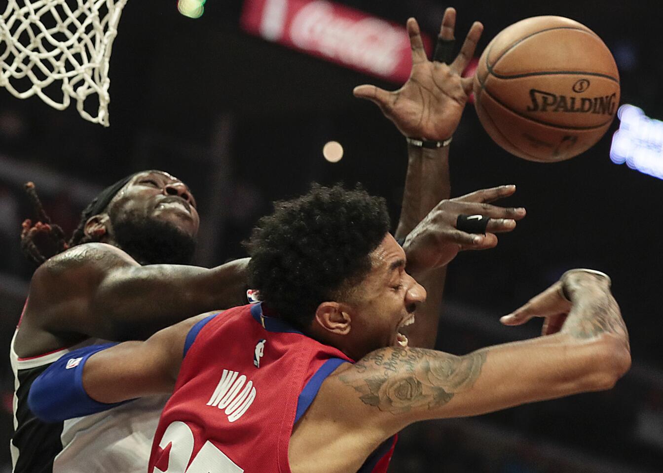 Clippers forward Montrezl Harrell battles Detroit Pistons forward Christian Wood for a rebound during the second half.