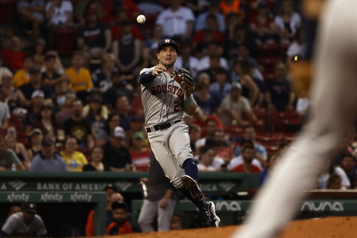 Houston Astros third baseman Alex Bregman throws out a Boston baserunner during the second inning of a baseball game Tuesday, June 8, 2021, at Fenway Park in Boston. (AP Photo/Winslow Townson)