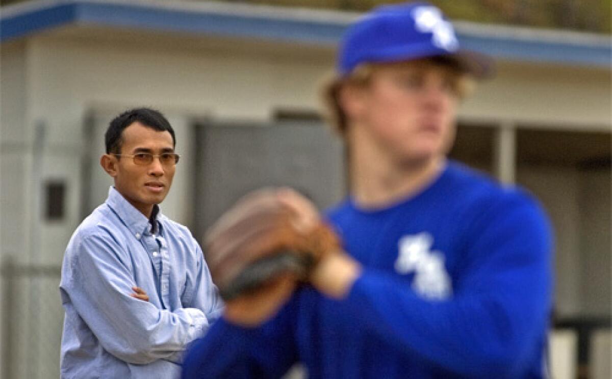 LOVE OF THE GAME: Joe Cook watches high school players in Dothan, Ala., where he lives. He says he has spent about $300,000 on Cambodian baseball since the fall of 2002  huge chunks of it coming out of his pocket.