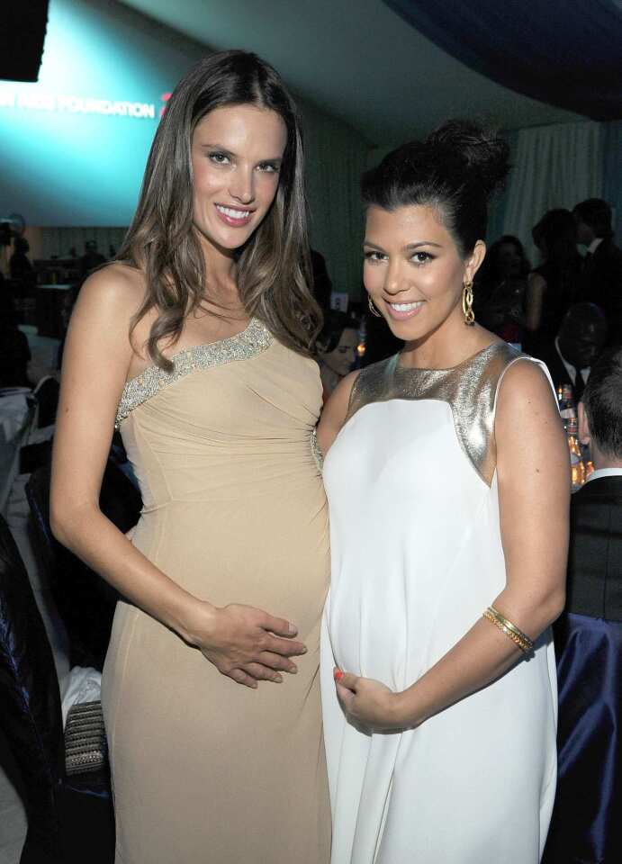 Pregnant mothers, model Alessandra Ambrosio, left, and television personality Kourtney Kardashian.