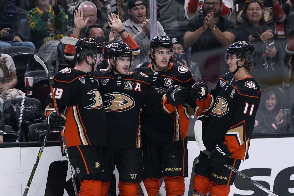 Ducks right wing Troy Terry celebrates his goal against the Arizona Coyotes with teammates.