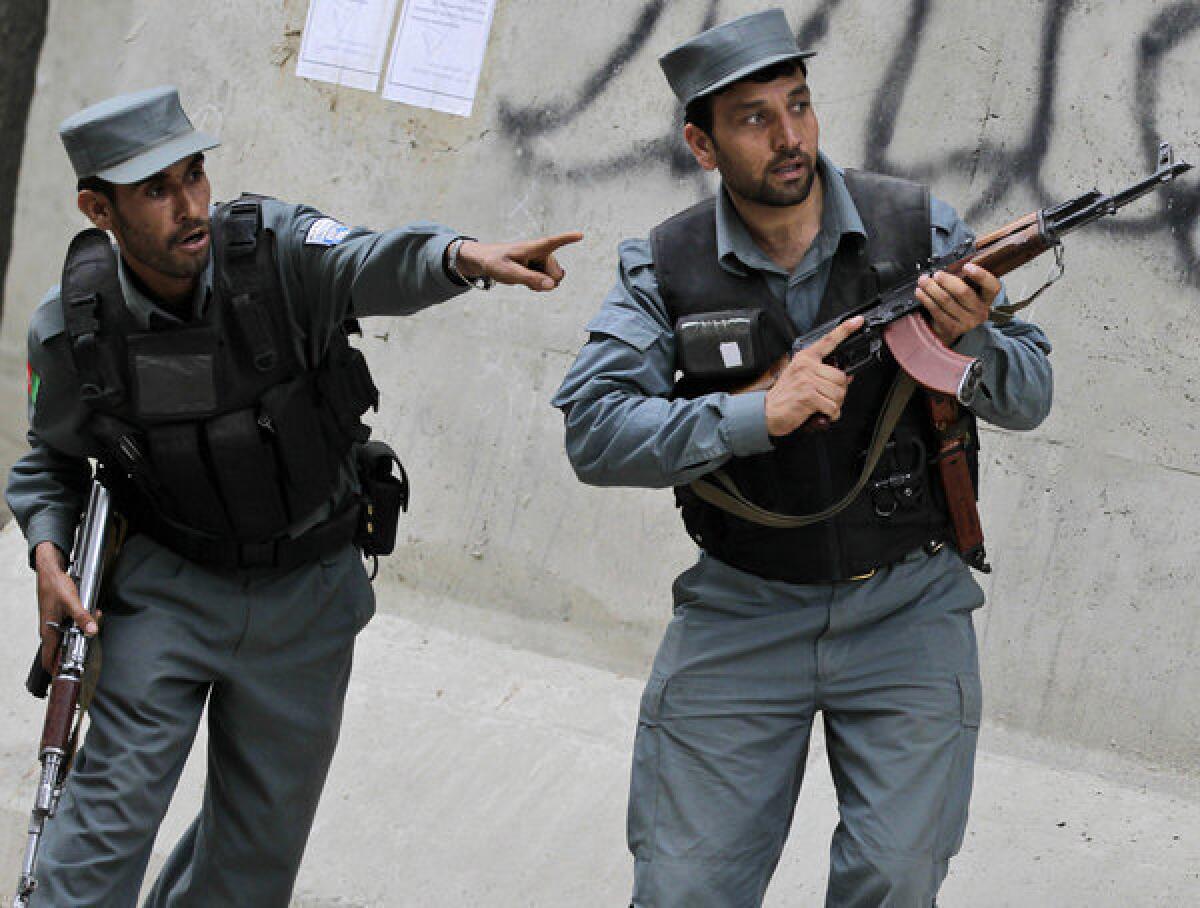 Police respond during a gun battle in the Afghan capital, Kabul.
