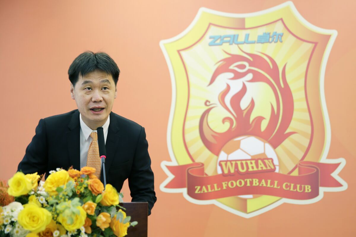Li Xiaopeng, speaks during a ceremony when he was newly-appointed the head coach of Wuhan Zall Football Club, in Wuhan in central China's Hubei province Sunday, Dec. 27, 2020. The Chinese Football Association said Friday, Dec 3, 2021, that the national men's soccer team coach Li Tie had resigned with the country struggling to qualify for next year's World Cup. Li Tie was replaced by fellow former national team player Li Xiaopeng. (Chinatopix Via AP)