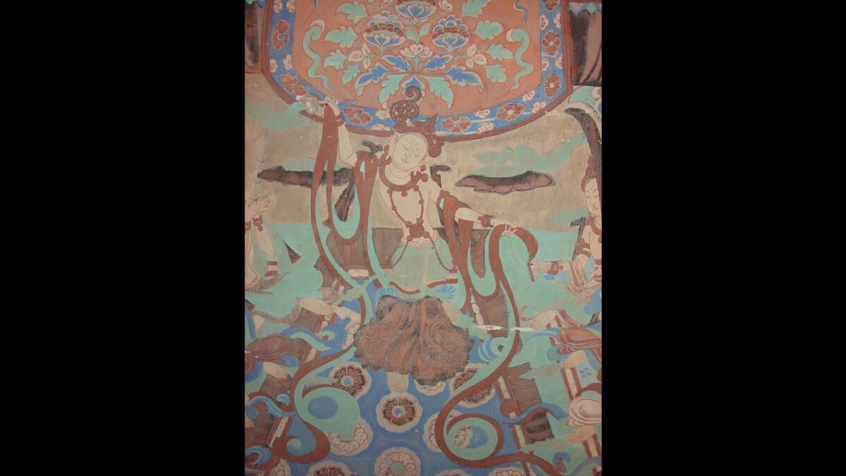 A wall painting of a dancing figure from the late Tang dynasty from the Mogao Grottoes.