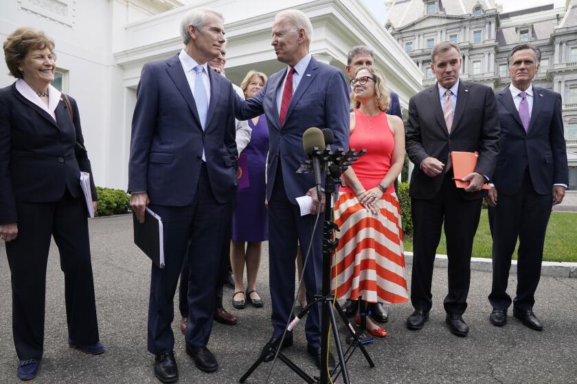 President Joe Biden speaks with Sen. Rob Portman, R-Ohio, and other bipartisan group of senators, Thursday June 24, 2021.