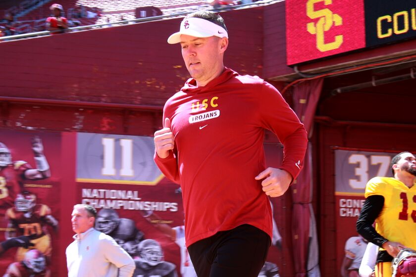 Los Angeles, CA - April 15: USC head coach Lincoln Riley, left, and USC quarterback.