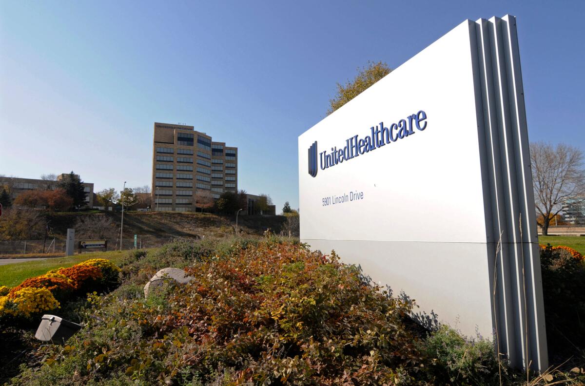 FILE - This Oct. 16, 2012, file photo, shows a portion of the UnitedHealth Group Inc.'s campus in Minnetonka, Minn. The nation's biggest health insurer is expanding a program that passes rebates from drugmakers directly to the people that use their medications. UnitedHealthcare said Tuesday, March 12, 2019, that next year, all of its new, employer-sponsored healthcare plans must give point-of-sale discounts to consumers when they pick up medications. (AP Photo/Jim Mone, File)