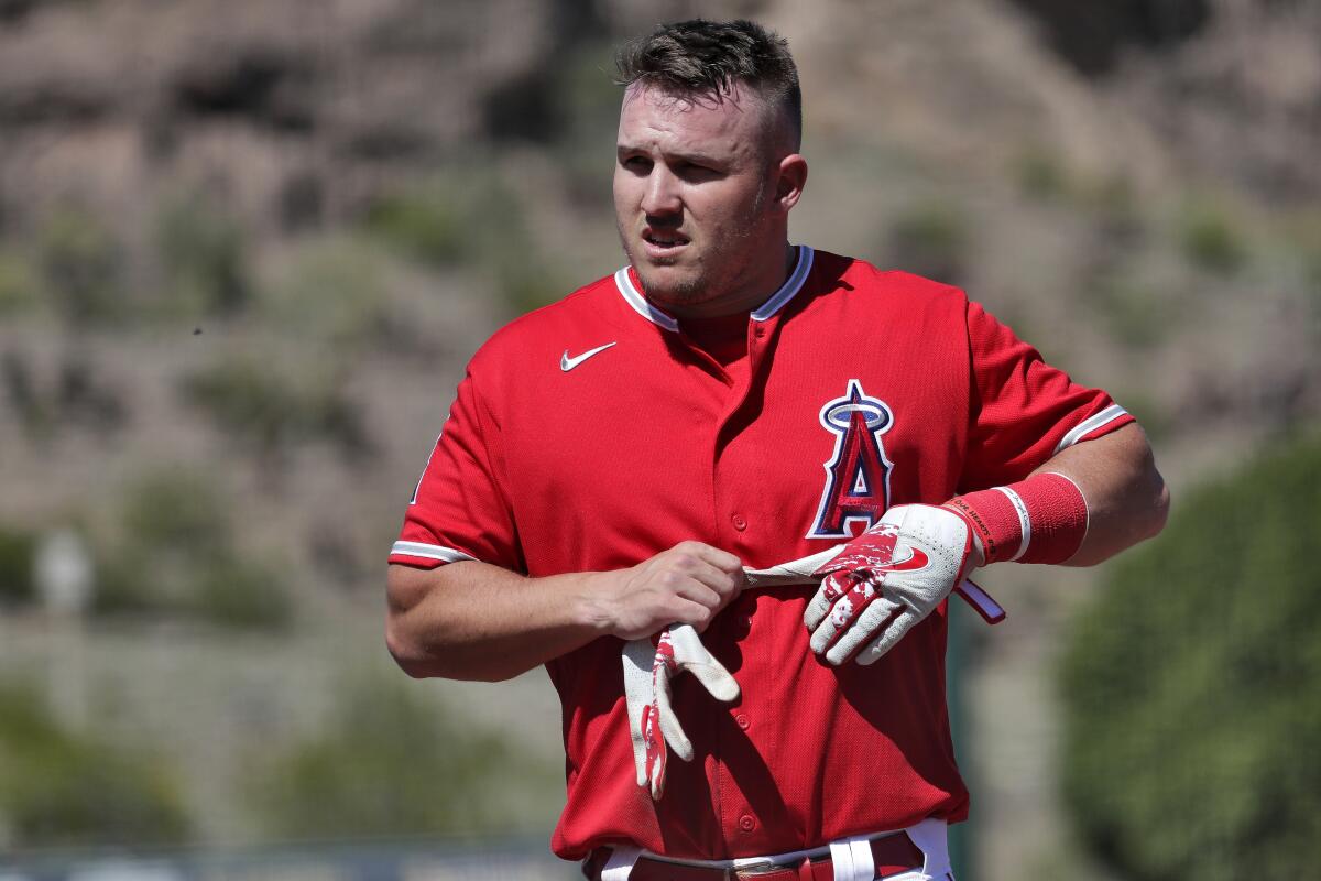 Los Angeles Angels' Mike Trout returns to the dugout.