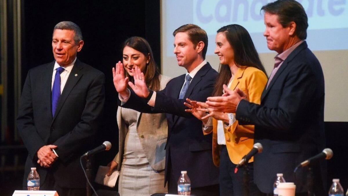 From left, candidates Doug Applegate, Sara Jacobs, Mike Levin, Christina Prejean (who since has dropped out) and Paul Kerr gather onstage at a recent forum for Democrats running for Rep. Darrell Issa's seat.