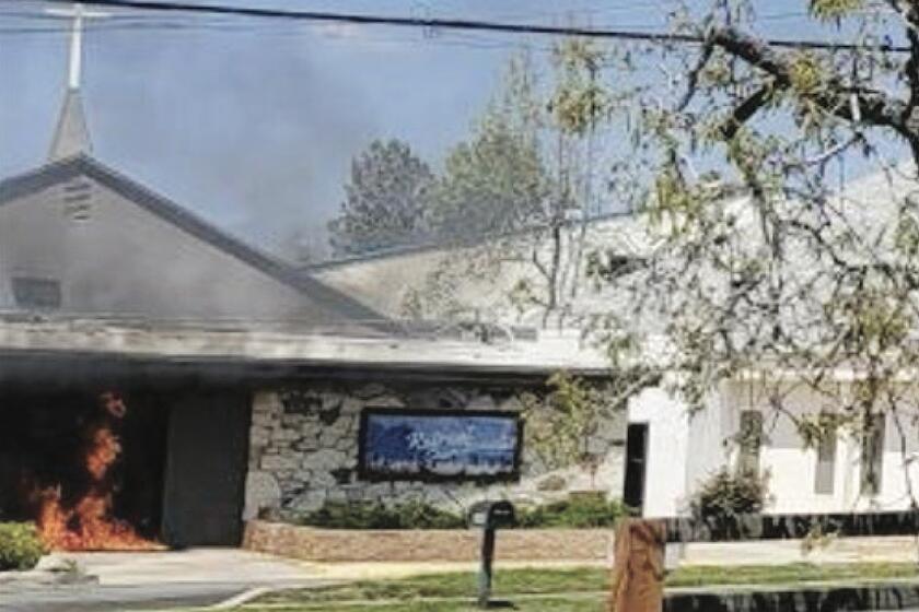 A photo from a criminal indictment show the a San Bernardino County church on fire. 