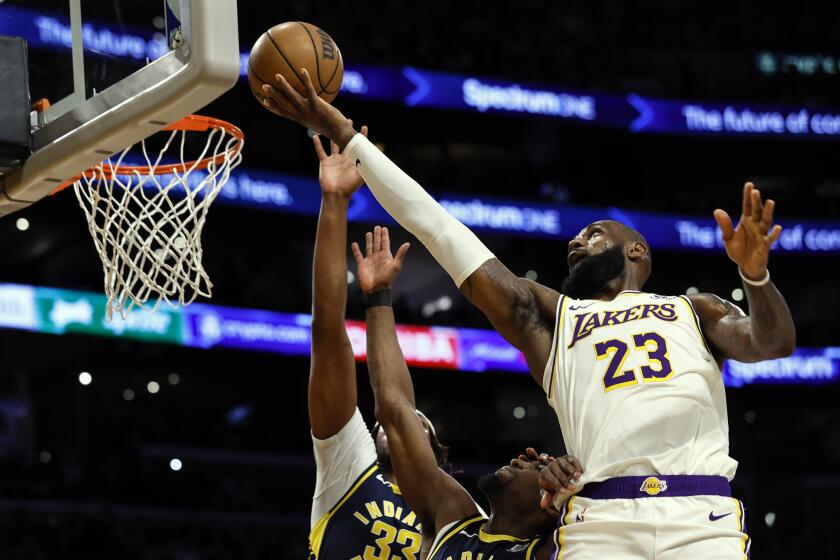 Lakers forward LeBron James (23) shoots over Indiana Pacers center-forward Myles Turner, March 24, 2024, in Los Angeles. 