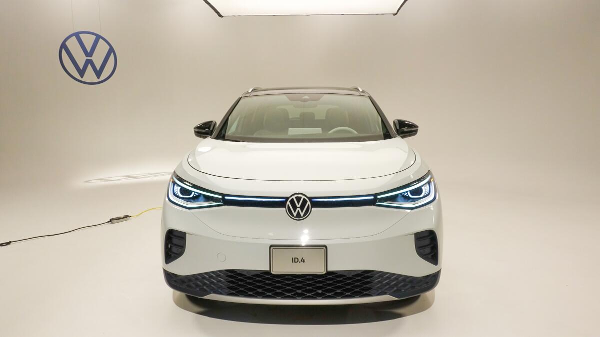 The all-electric Volkswagen ID.4 compact SUV shown from the front in a studio.