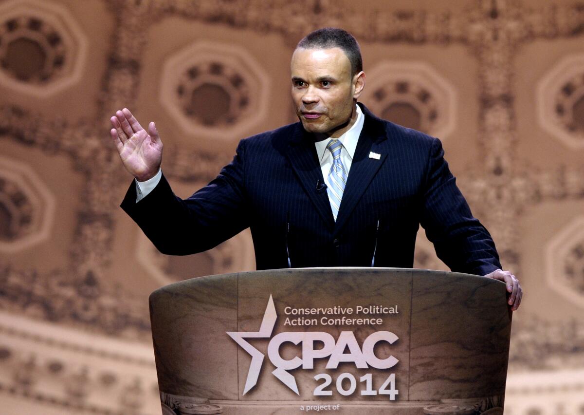 Conservative commentator Dan Bongino at a podium that says CPAC 2014