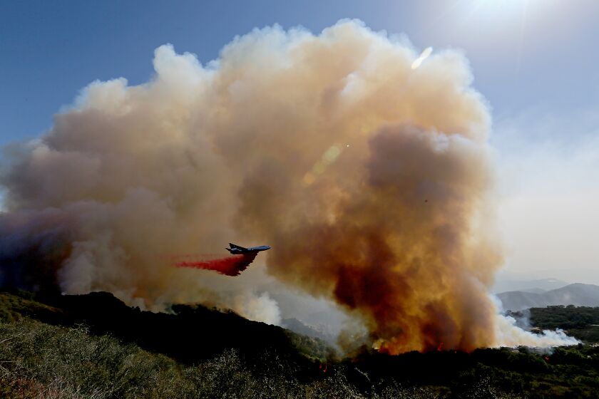 GOLETA, CALIF. - OCT.13, 2021. A firefighing airplane drops fire retardant ahead of the Alisal fire near Goleta on Wednesday, Oct. 13, 2021. (Luis Sinco / Los Angeles Times)