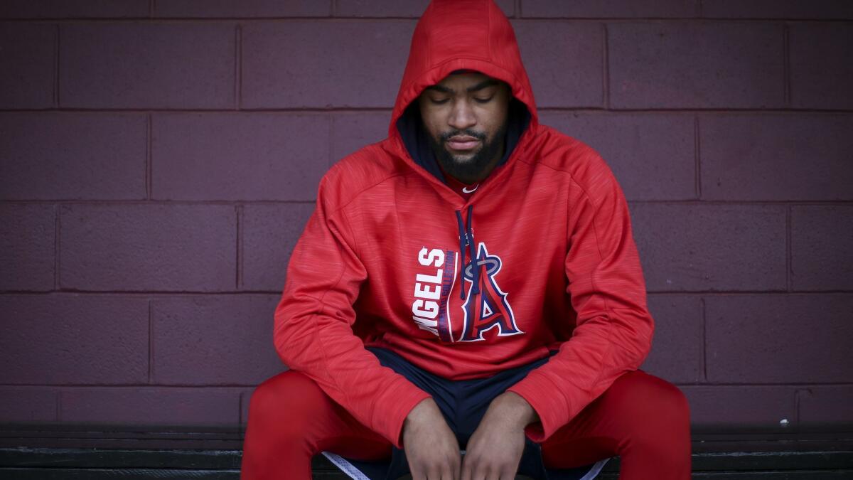 Angels prospect, centerfielder Jo Adell sits for a portrait in the baseball dugout at Ballard High School in Louisville, Ky. on Jan. 29.