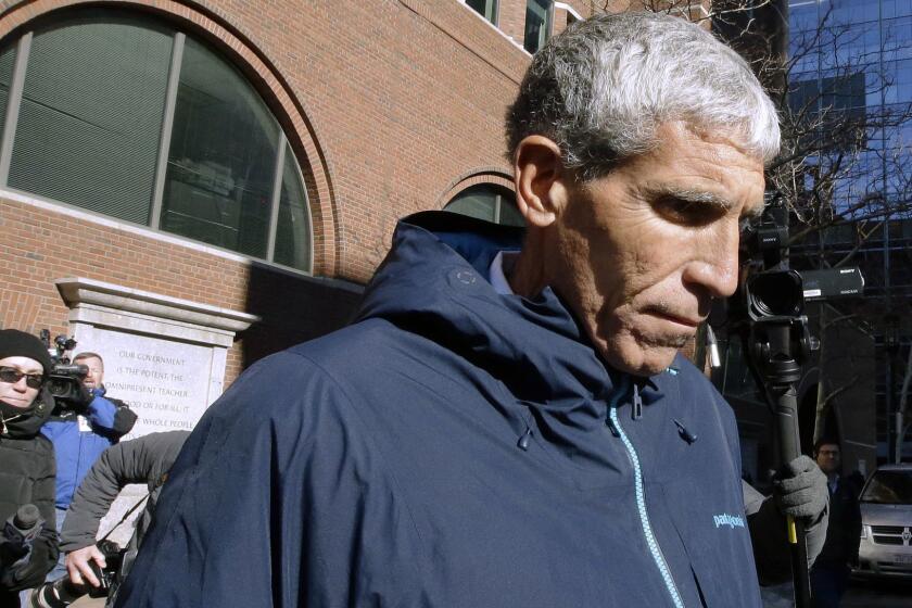 William "Rick" Singer founder of the Edge College & Career Network, departs federal court in Boston on Tuesday, March 12, 2019, after he pleaded guilty to charges in a nationwide college admissions bribery scandal. (AP Photo/Steven Senne)