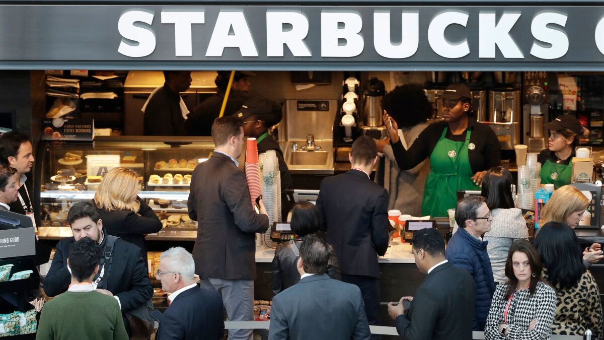 People line up to order at a Starbucks in New York City on Jan. 14.