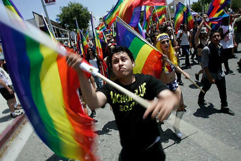 Crowds march along Santa Monica Boulevard in West Hollywood in the 40th annual L.A. Pride parade, part of a two-day festival celebrating the gay, lesbian, bisexual and transgender community.