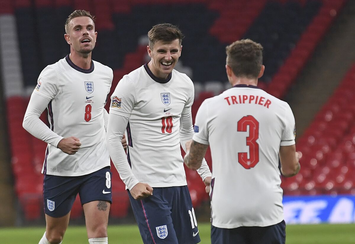 England's Mason Mount, center, celebrates after scoring his side's second goal during the UEFA Nations League soccer match between England and Belgium at Wembley stadium in London, Sunday, Oct. 11, 2020. (Neil Hall/Pool via AP)