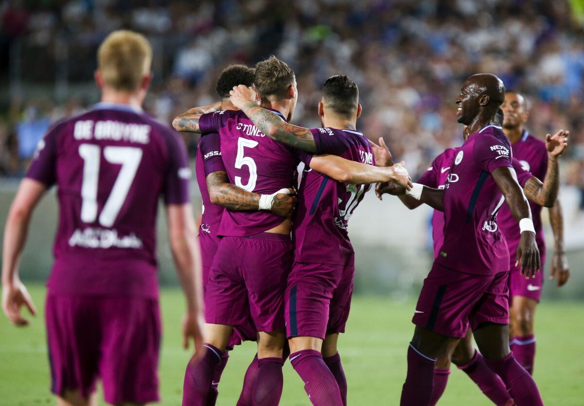 Writer Reg Green laments the fortunes of his favorite team, Manchester City, who on March 8 lost a match to Manchester United, 2-0. Above, Manchester City players celebrate a goal during the second half of a 2017 match.