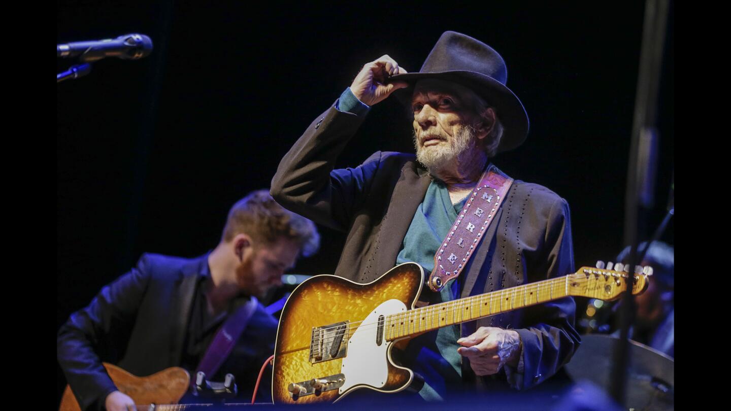 Merle Haggard tips his hat to the audience as he performs at the Saban Theatre.