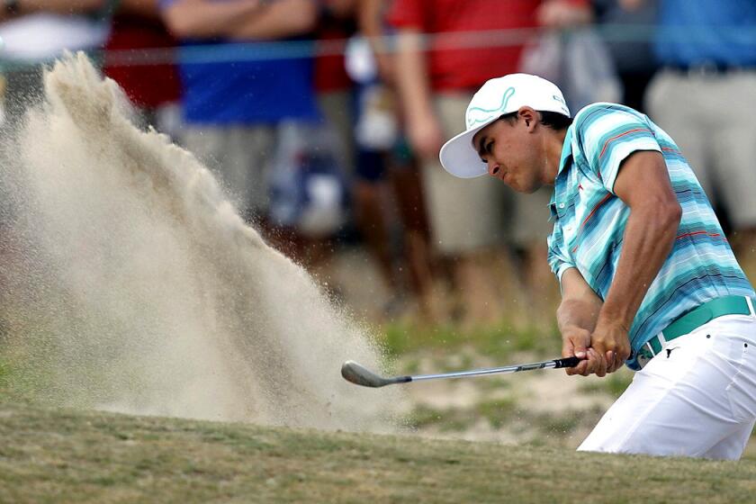 Ricky Fowler hits out of a trap at the 11th hole during the third round of the U.S. Open on Saturday at Pinehurst.