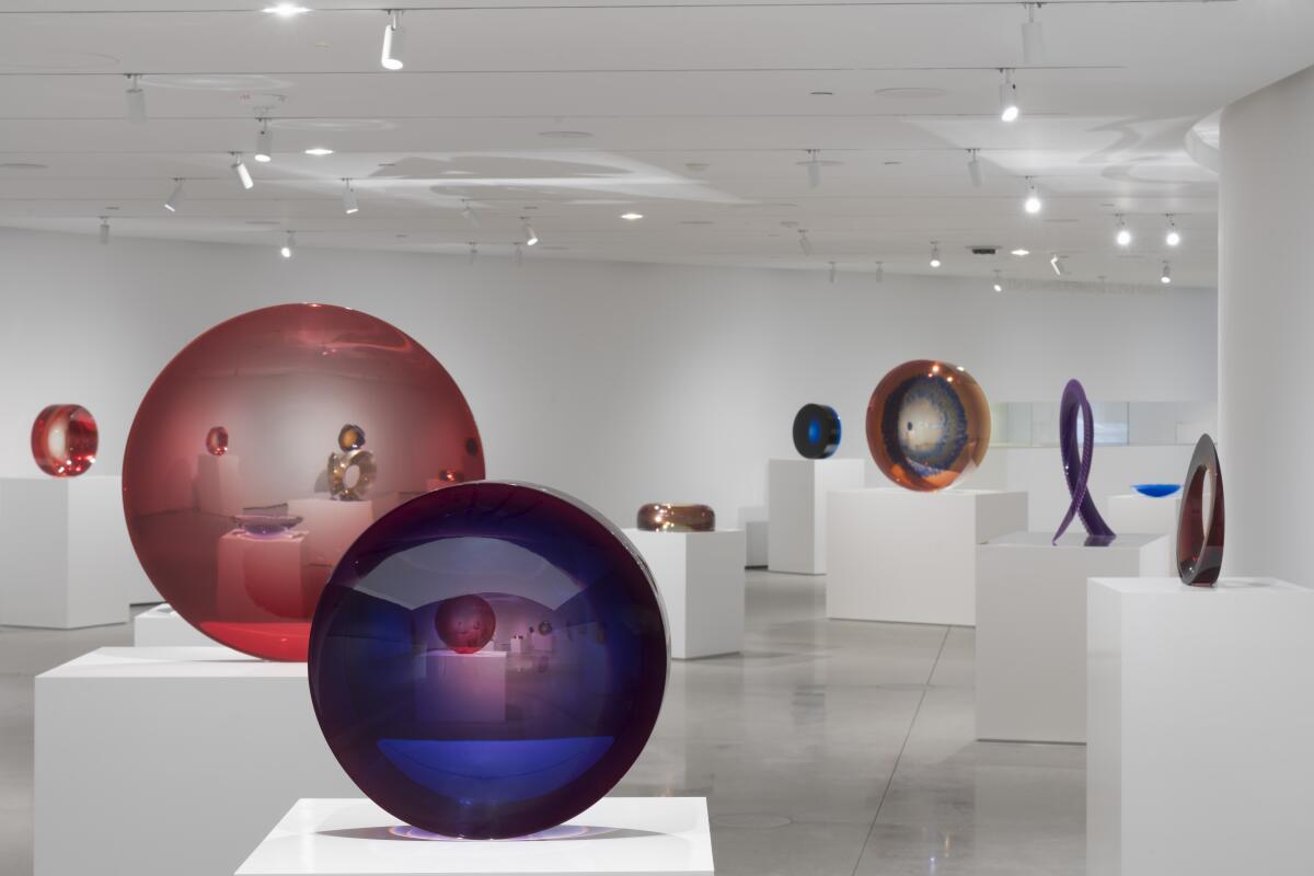 Plastic sculptures in a white gallery.