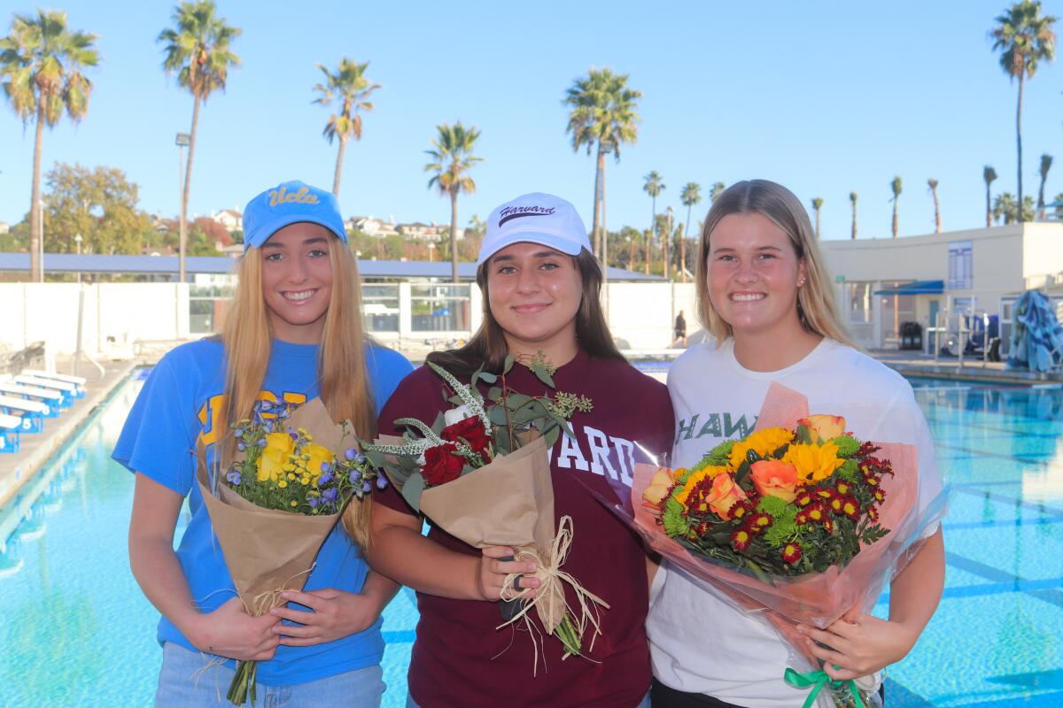 Corona del Mar High's Grace Myers, left, Kaitlyn Greenwald, center, and Katherine Snyder celebrate their commitments.