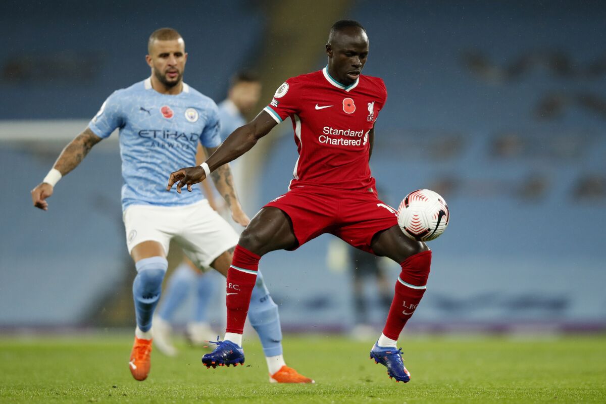Liverpool's Sadio Mane controls the ball during the English Premier League soccer match between Manchester City and Liverpool at the Etihad stadium in Manchester, England, Sunday, Nov. 8, 2020. (Clive Brunskill/Pool via AP)