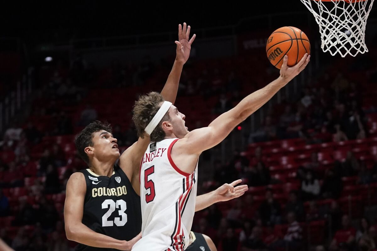 Utah guard Jaxon Brenchley (5) goes to the basket as Colorado forward Tristan da Silva (23) defends during the second half of an NCAA college basketball game Saturday, March 5, 2022, in Salt Lake City. (AP Photo/Rick Bowmer)