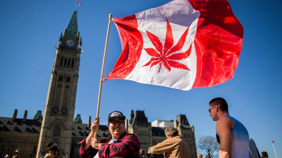 A woman celebrates National Marijuana Day in Ottawa. Canadian lawmakers voted Tuesday to legalize cannabis.