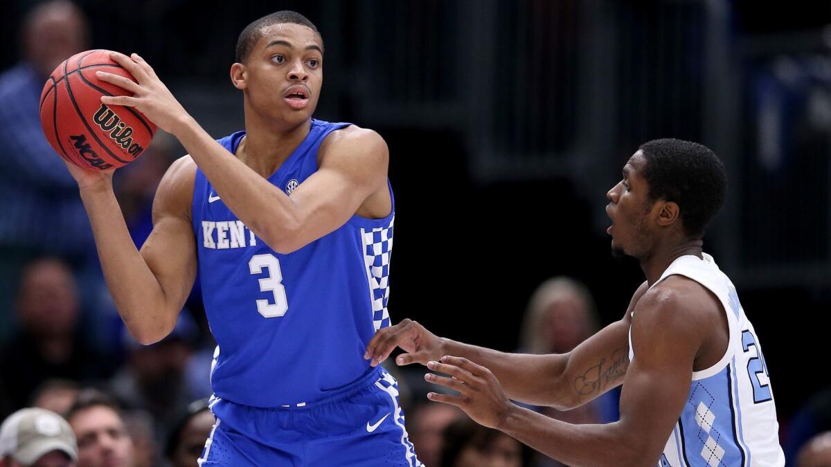 Keldon Johnson (3) of the Kentucky Wildcats handles the ball while being guarded by Kenny Williams of the North Carolina Tar Heels in the second half.