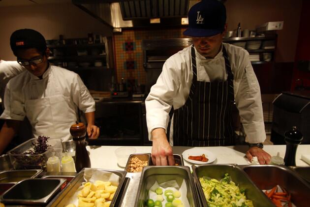 Chef Tim Carey, right, stresses local fresh produce in his dishes.