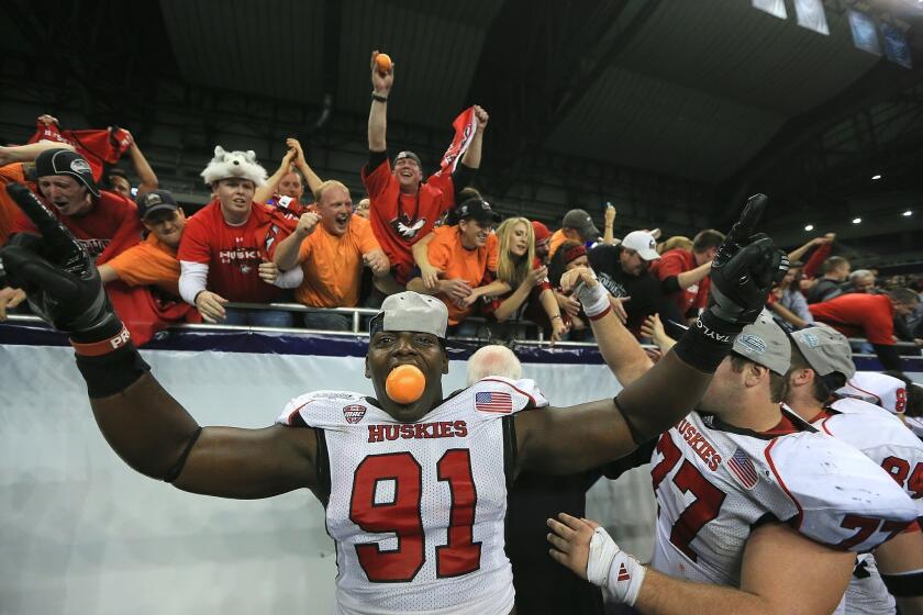 Northern Illinois' Anthony Wells celebrates after the Huskies defeated Kent State in the Mid-American Conference championship game.