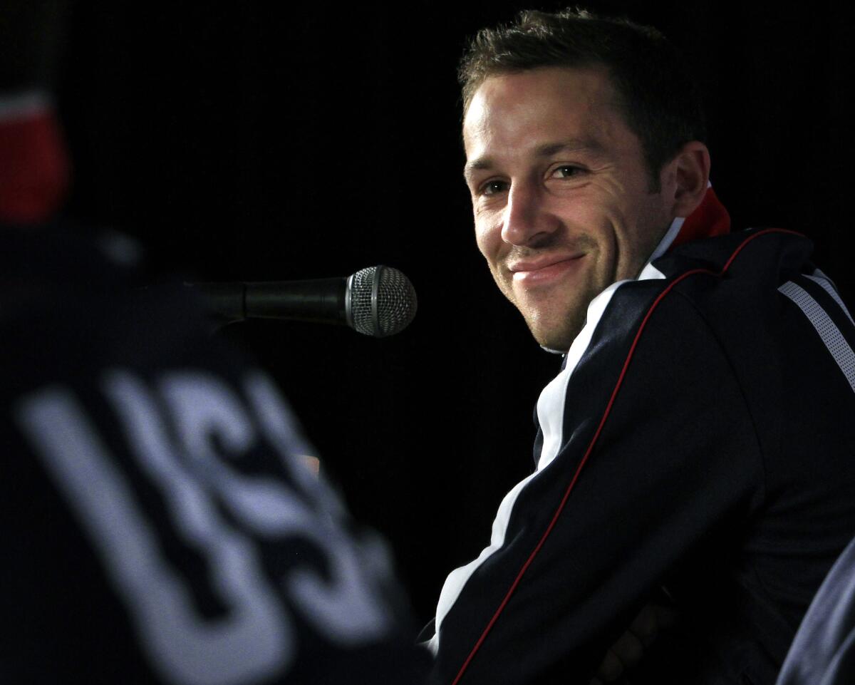 U.S. national soccer defender Steve Cherundolo smiles during a news conference.