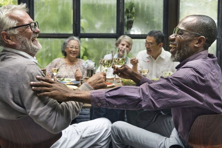 Mature friends at a dinner party User Upload Caption: Research affirms that an active social life is a key factor for a long and happy life.