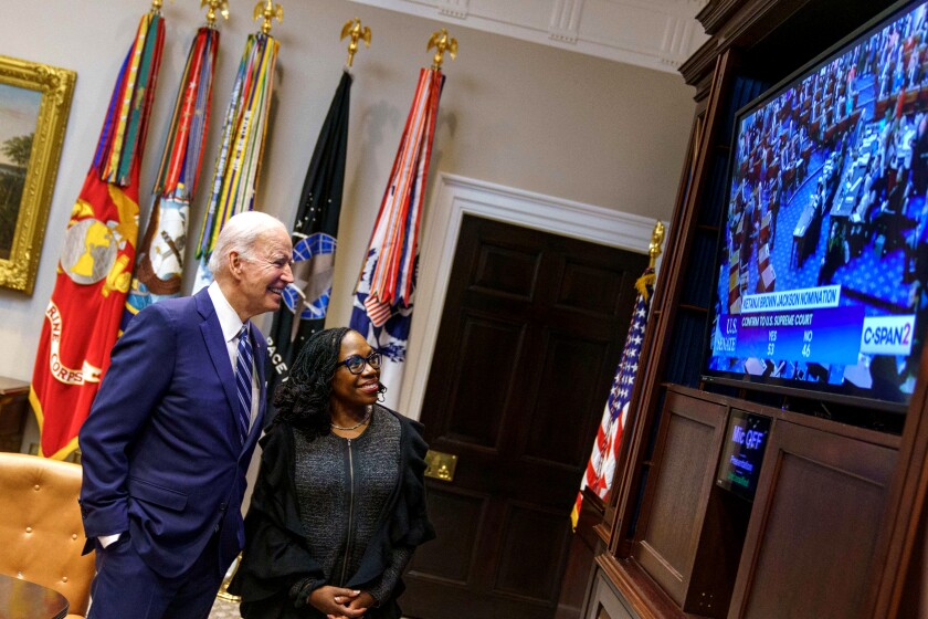 President  Biden and Judge Ketanji Brown Jackson watch a TV monitor.