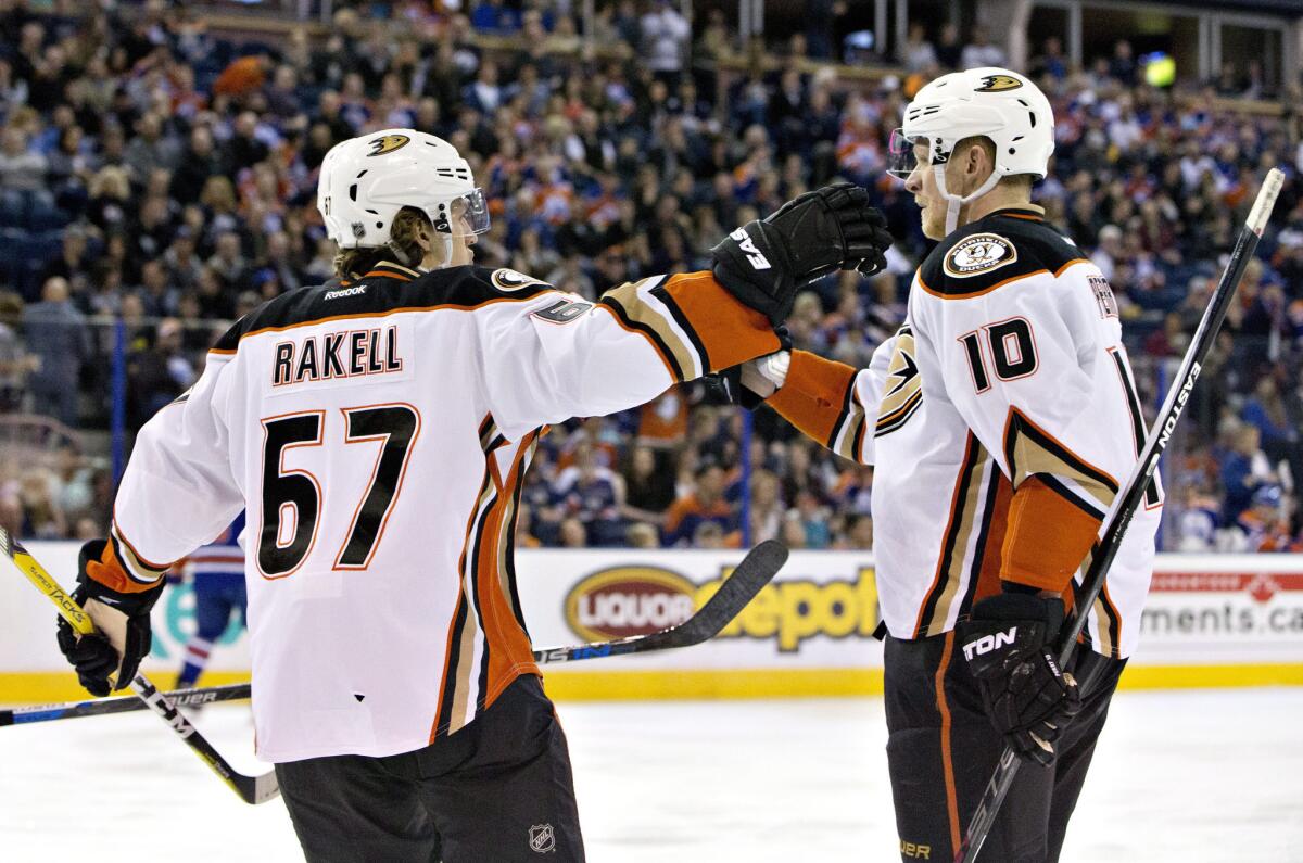 Ducks center Rickard Rakell (67) and right wing Corey Perry (10) celebrate a goal against the Edmonton Oilers during the first period.