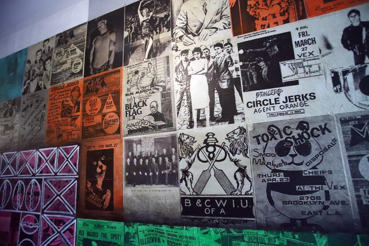 A hallway wallpapered with concert posters.