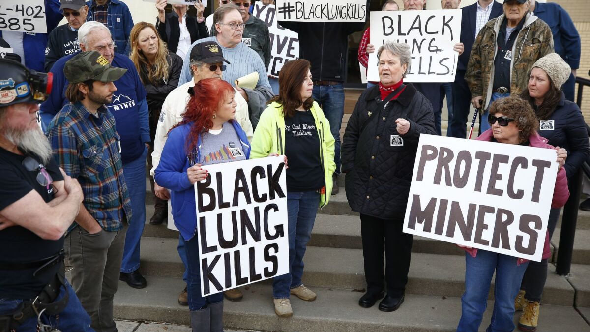 Patty Amburgey, of Letcher, Ky., speaks about the death of her husband from black lung disease during a protest near the office of Senate Majority Leader Mitch McConnell at the Laurel County Justice Center in London, Ky.
