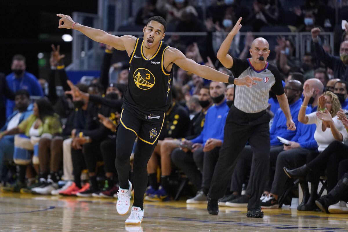 Golden State Warriors guard Jordan Poole (3) celebrates after making a 3-point basket against the New Orleans Pelicans during the second half of an NBA basketball game in San Francisco, Friday, Nov. 5, 2021. (AP Photo/Jeff Chiu)