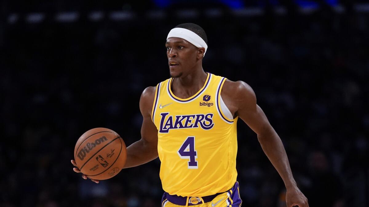 Lakers guard Rajon Rondo controls the ball during a game against the Charlotte Hornets.