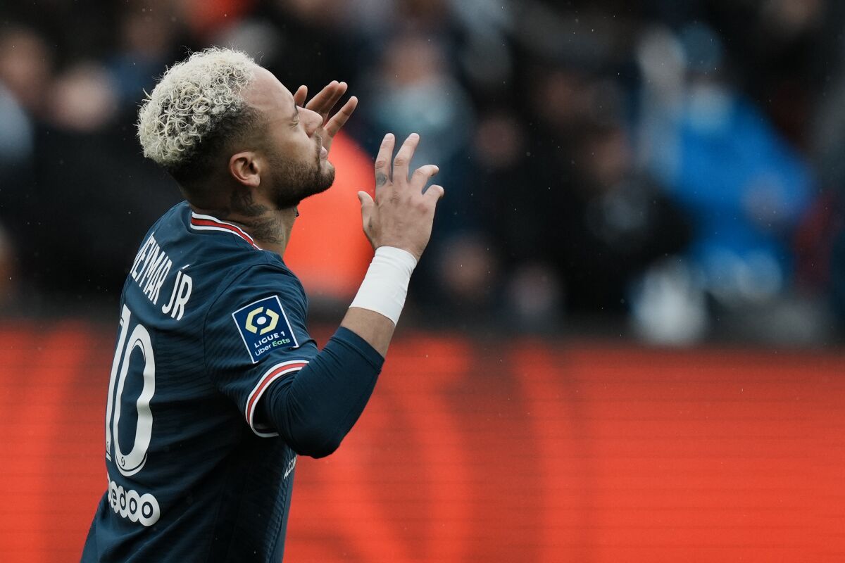 PSG's Neymar gestures after missing a scoring chance during the French League One soccer match between Paris Saint-Germain and Bordeaux at the Parc des Princes stadium in Paris, France, Sunday, March 13, 2022. (AP Photo/Thibault Camus)