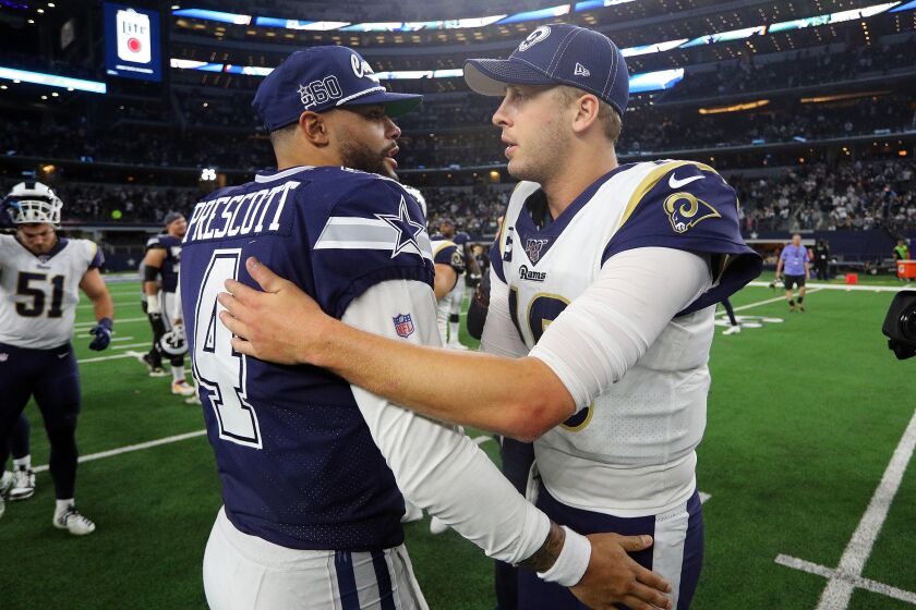 ARLINGTON, TEXAS - DECEMBER 15: Dak Prescott #4 of the Dallas Cowboys hugs Jared Goff #16 of the Los Angeles Rams after the game at AT&T Stadium on December 15, 2019 in Arlington, Texas. (Photo by Richard Rodriguez/Getty Images)